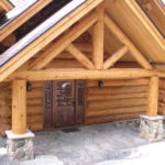 Log home entry, carved door