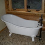 Clawfoot tub, pebble floor, master bath