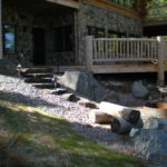 Log home decks, stone foundation