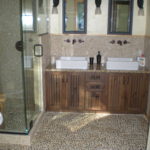 granite top vanity, pebble floor