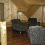 loft sitting area, logs, hickory floors