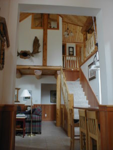 Looking up at the loft area from living room