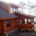 Screen porch on cedar log cabin