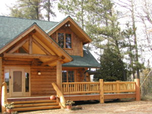 Cedar Logs and railing, dormers, main entry