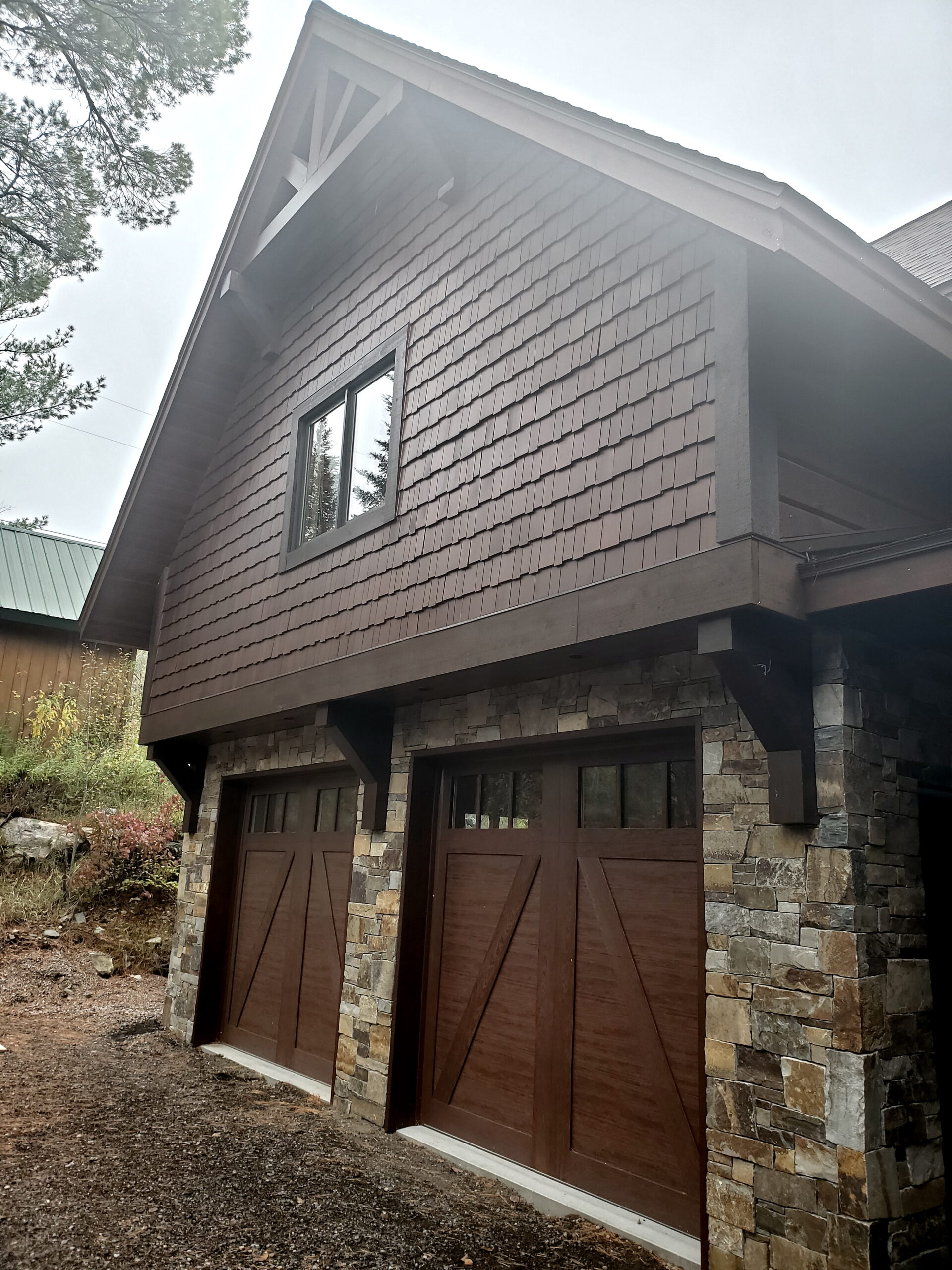 Garage doors on custom home by huisman Concepts